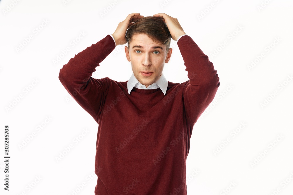 portrait of a man with hands on his head portrait of a man with hands on his head
