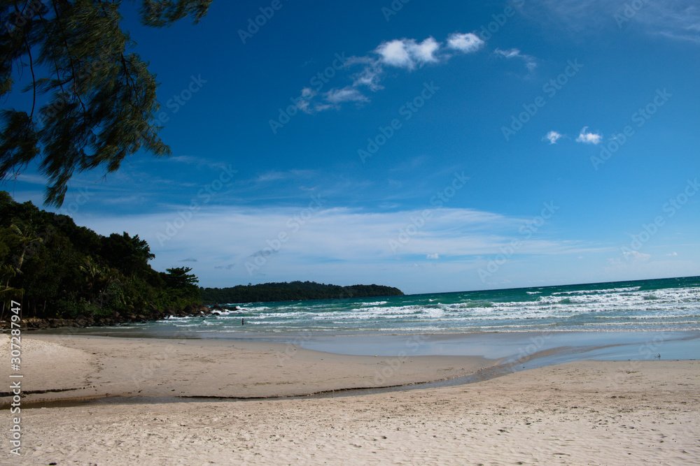 The waterway flows from the island to the sea at one beautiful beach.