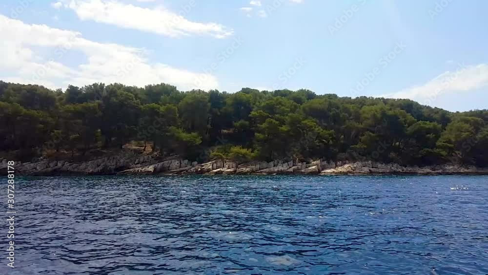 Cruising between islands by boat looking towards island Cruising between islands by boat looking towards island