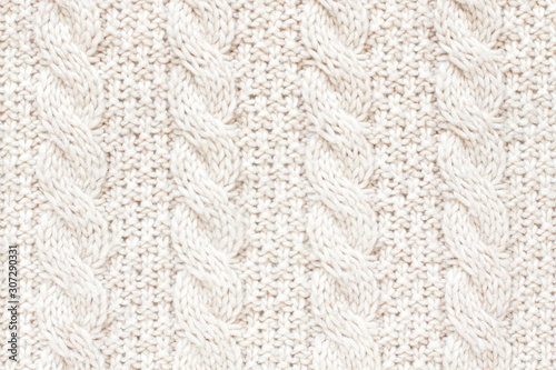 Cable knitting stitch pattern, soft woolen texture, handmade knitted cloth photo