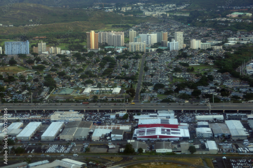 Aerial view of the Honolulu Highway, Car Rental Buildings, Golf Course, and Moanalua Comminuty