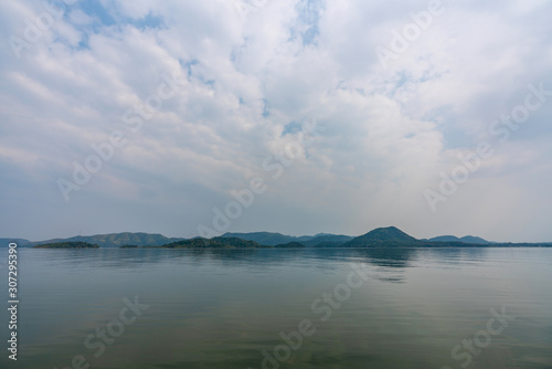 beautiful blue sky green forest mountains lake view at Kaeng Krachan National Park, Thailand. an idea for backpacker hiking on long weekend or a couple, family activity camping holiday relaxing