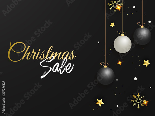Christmas Sale Poster Design Decorated with Hanging Baubles, Golden Stars and Snowflakes on Black Background.