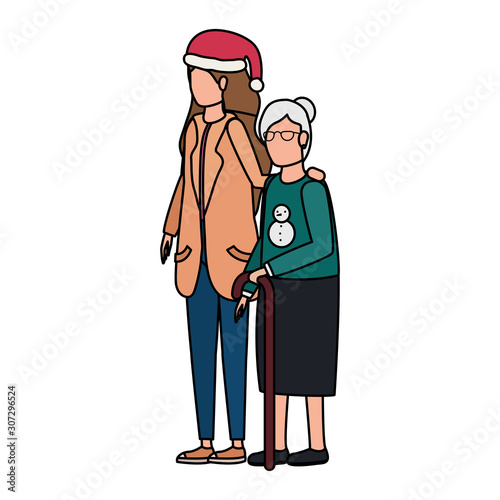 cute grandmother with daughter using christmas hat