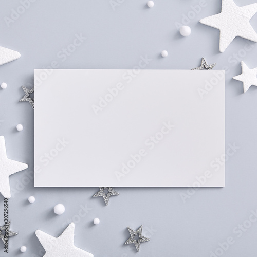 White and silver star with white paper blank