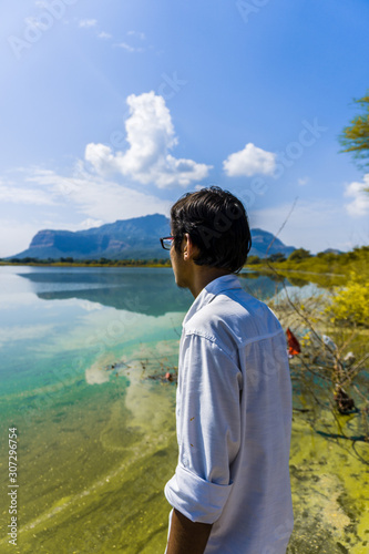 Young adult man at Vadatalav Lake also known as Pavagadh lake photo