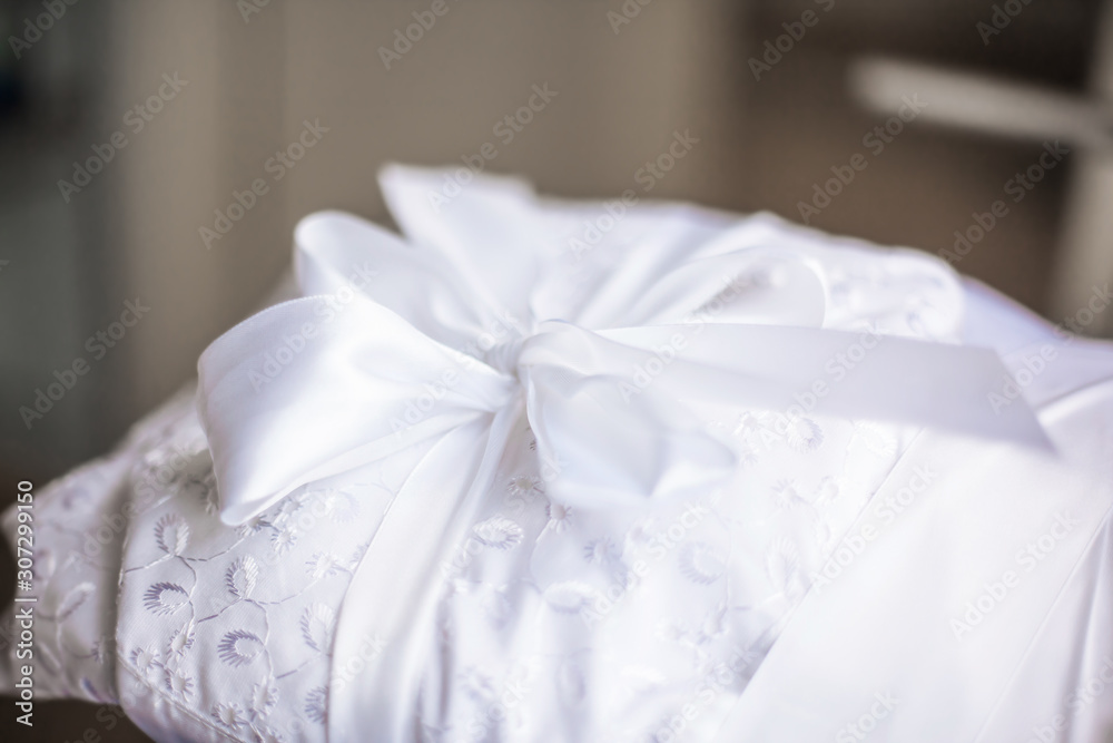 close up.beautiful tied ribbon on a baby blanket close up.beautiful tied ribbon on a baby blanket
