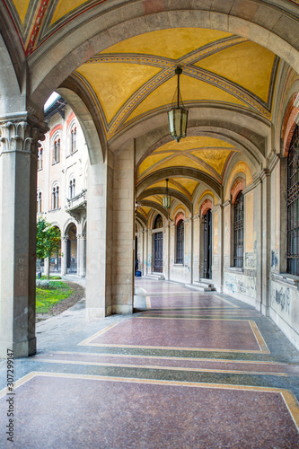 Narrow city street view traditional architectural features in Bologna, Italy