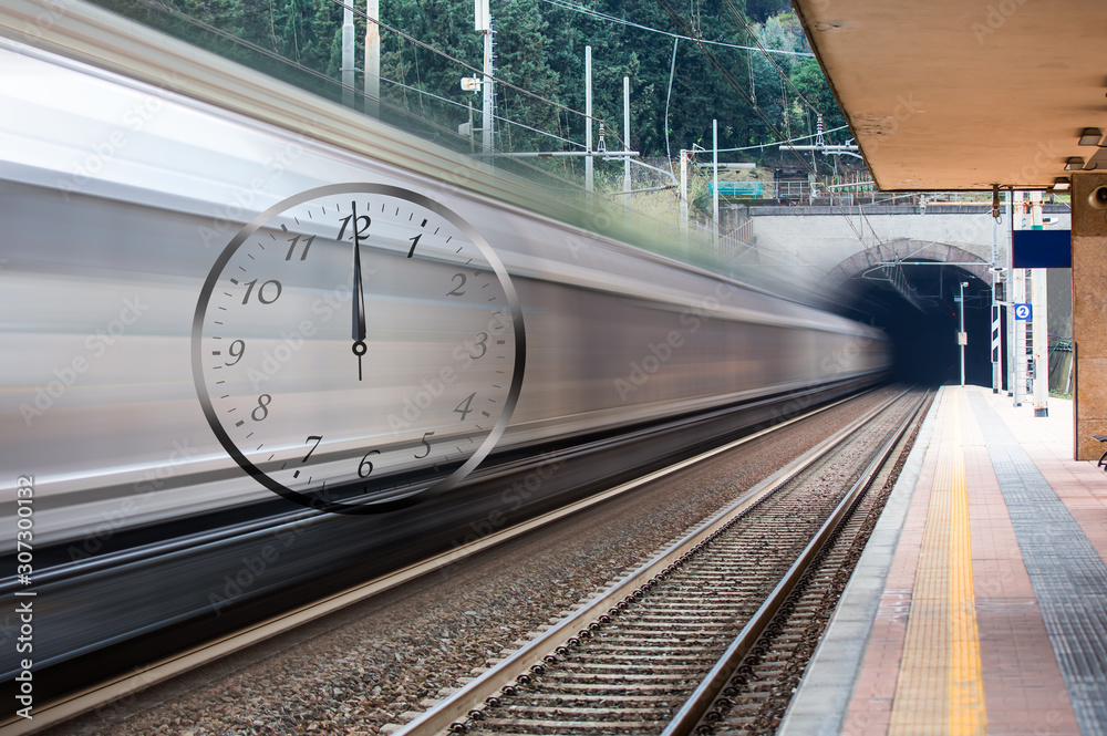 Naklejka premium Train in motion at a railway station- train hours