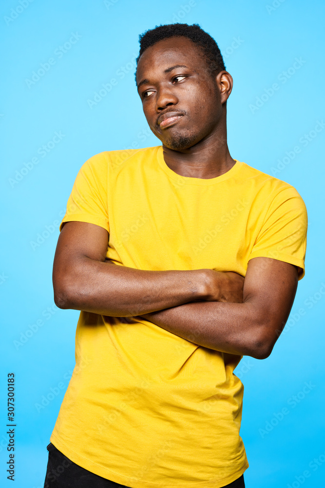 portrait of young man with arms crossed portrait of young man with arms crossed
