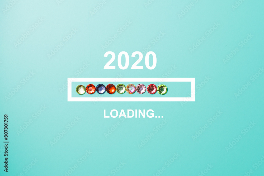 Fototapeta premium progress bar showing loading of 2020 with rhinestones on blue background