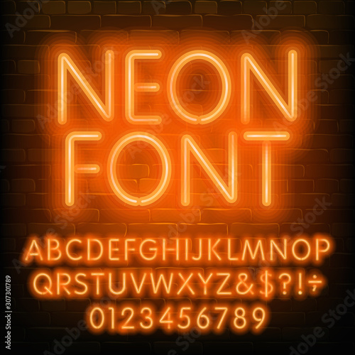 Neon alphabet font. Simple orange neon letters and numbers. Brick wall background. Stock vector typescript for your typography design.