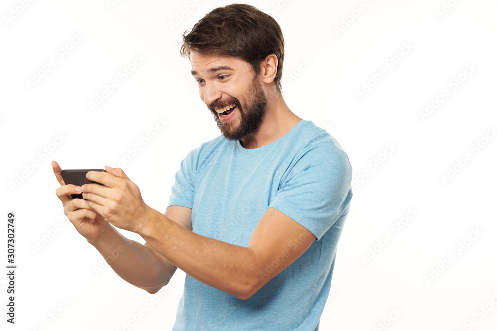 young man texting on mobile phone young man texting on mobile phone