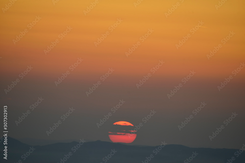 Big sun sky at beautiful sunset in autumn season Big sun sky at beautiful sunset in autumn season