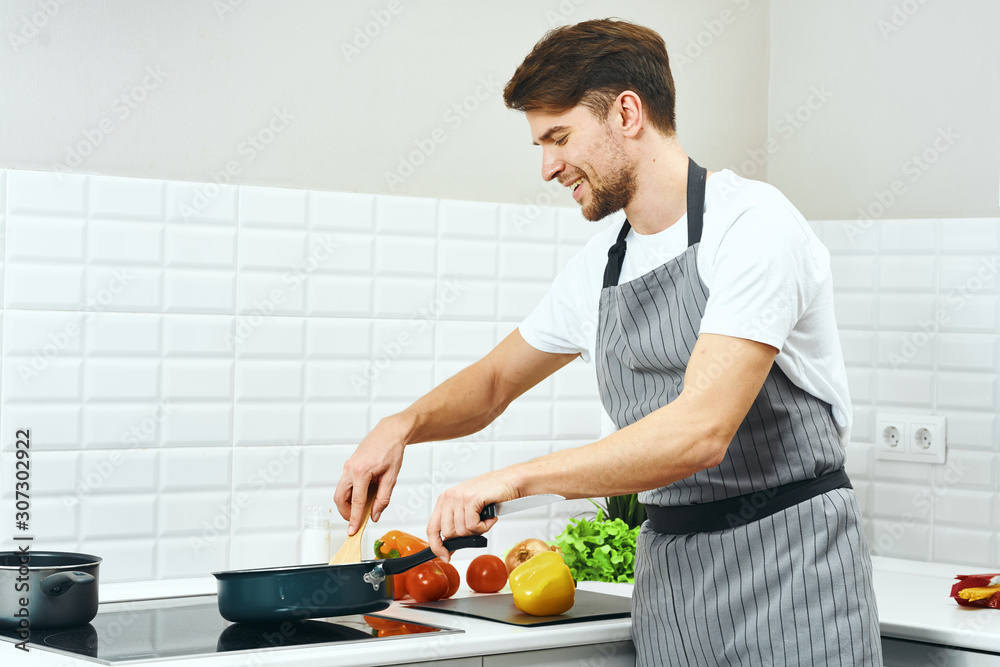 woman cutting vegetables in the kitchen woman cutting vegetables in the kitchen