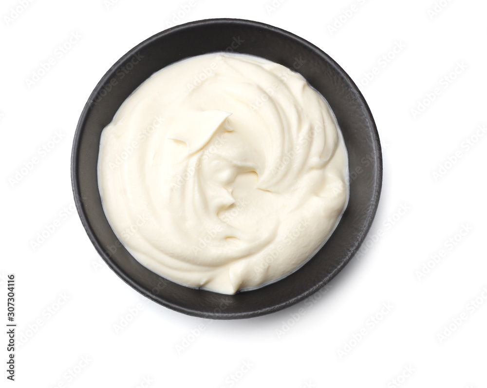 sour cream in black bowl isolated on white background. top view sour cream in black bowl isolated on white background. top view