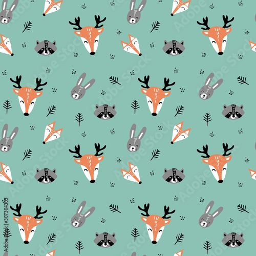 Seamless pattern with cute cartoon woodland animals faces in scandinavian style with branches on green background. Flat vector illustration.