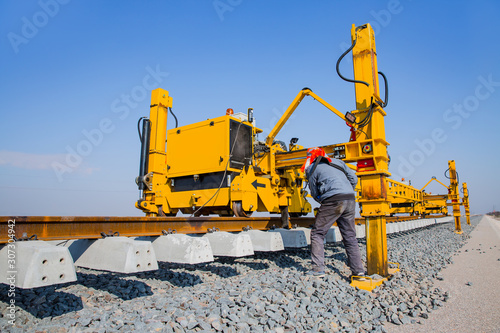 Metro (train) construction site, railroad track installation machine is in use