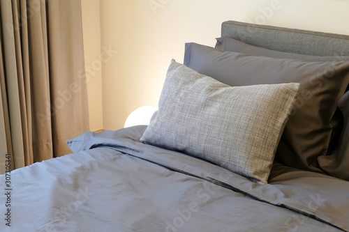 soft pillows on the comfortable  bed © lmanju
