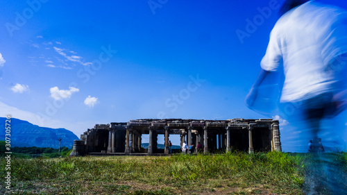 Young man exploring heritage Kabutar khana Pavilion also known as Khajuri mosque( masjid ) photo