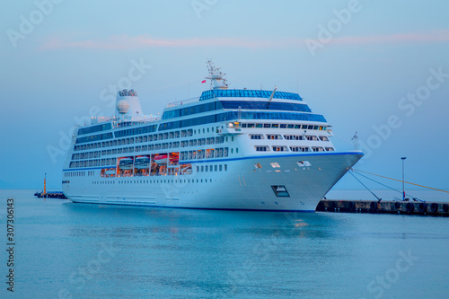 Fototapeta Naklejka Na Ścianę i Meble -  Beautiful white giant luxury cruise ship on stay at Alanya harbor