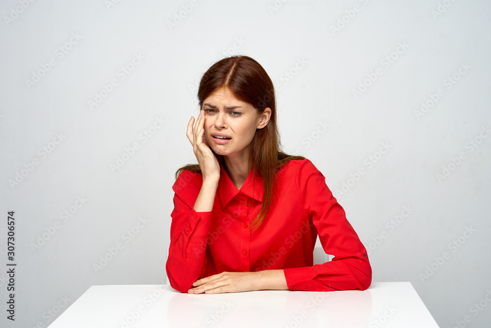 young woman sitting on the floor with book