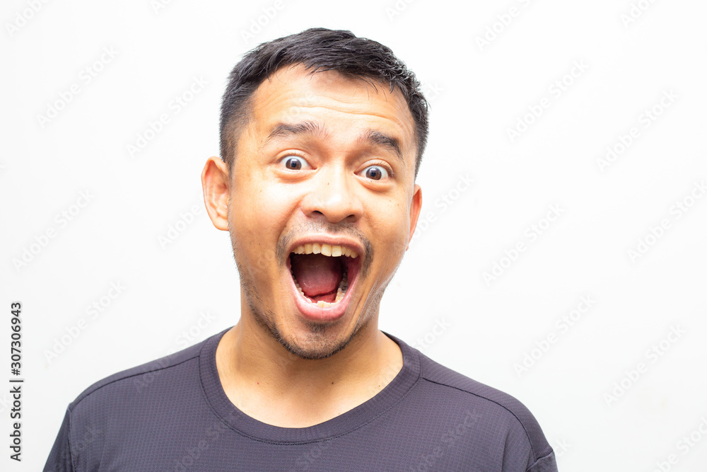 Portrait of amazing facial expression asian men face on white background Portrait of amazing facial expression asian men face on white background