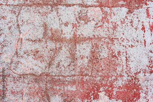 Texture of a concrete wall with cracks and scratches which can be used as a background