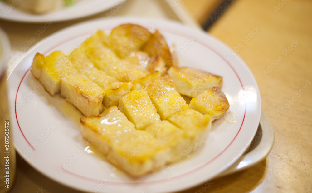 Buttered toast with condensed milk and sugar