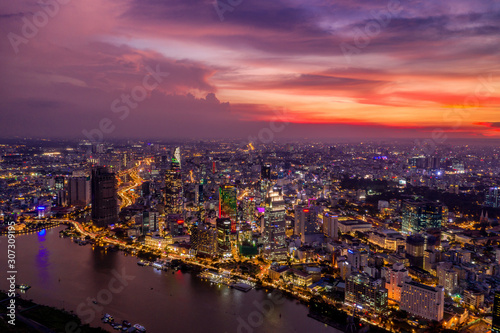 Saigon beautiful cityscape and lights with orange sunset skyline  © Quang