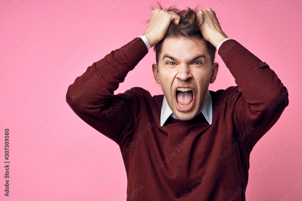 portrait of a man with hands on his head portrait of a man with hands on his head