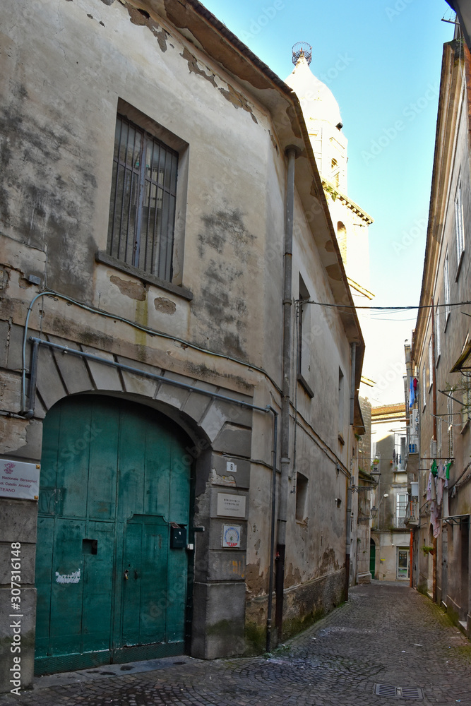 Fototapeta premium Teano, Italy, 11/30/2019. A street among the old houses of a medieval village