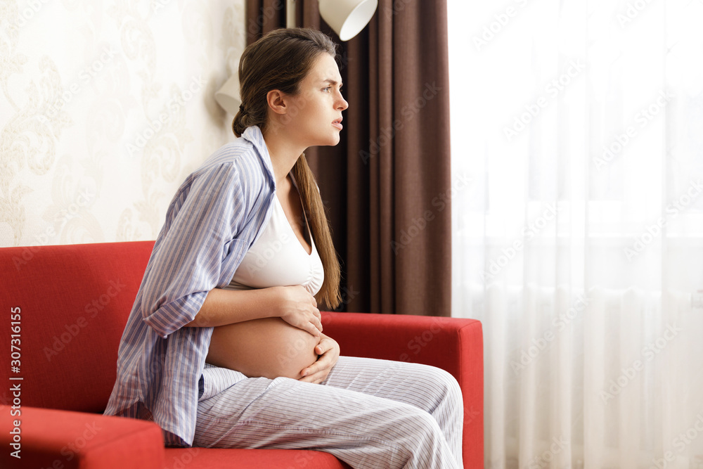 Pregnant woman at home. Different health problems during pregnancy. Pregnant woman at home. Different health problems during pregnancy.