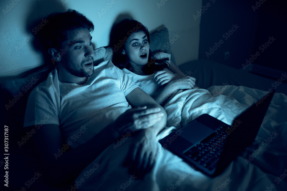 thief stealing data from laptop