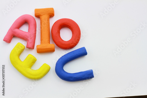 vowels a e i o u background white photo