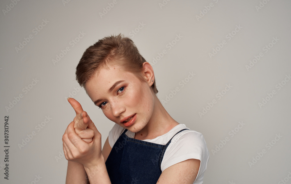portrait of young woman with finger on her lips portrait of young woman with finger on her lips