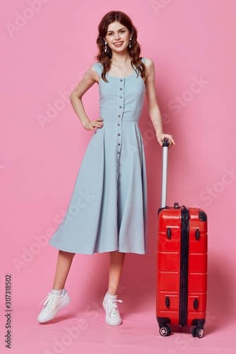 girl in a dress with suitcase