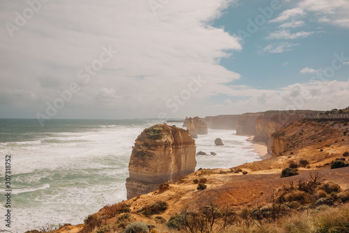 Ocean coast with cliffs and rock pillars and waves at 12 Apostles, the Great Ocean Road