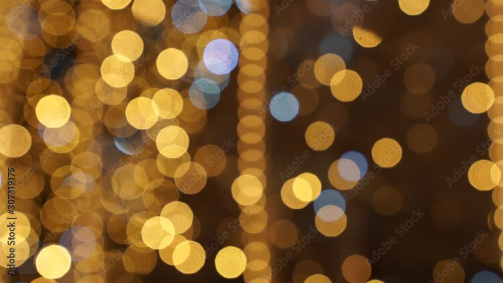 This 4K footage is of golden and white Holiday lights that are out of focus that can be used as background.