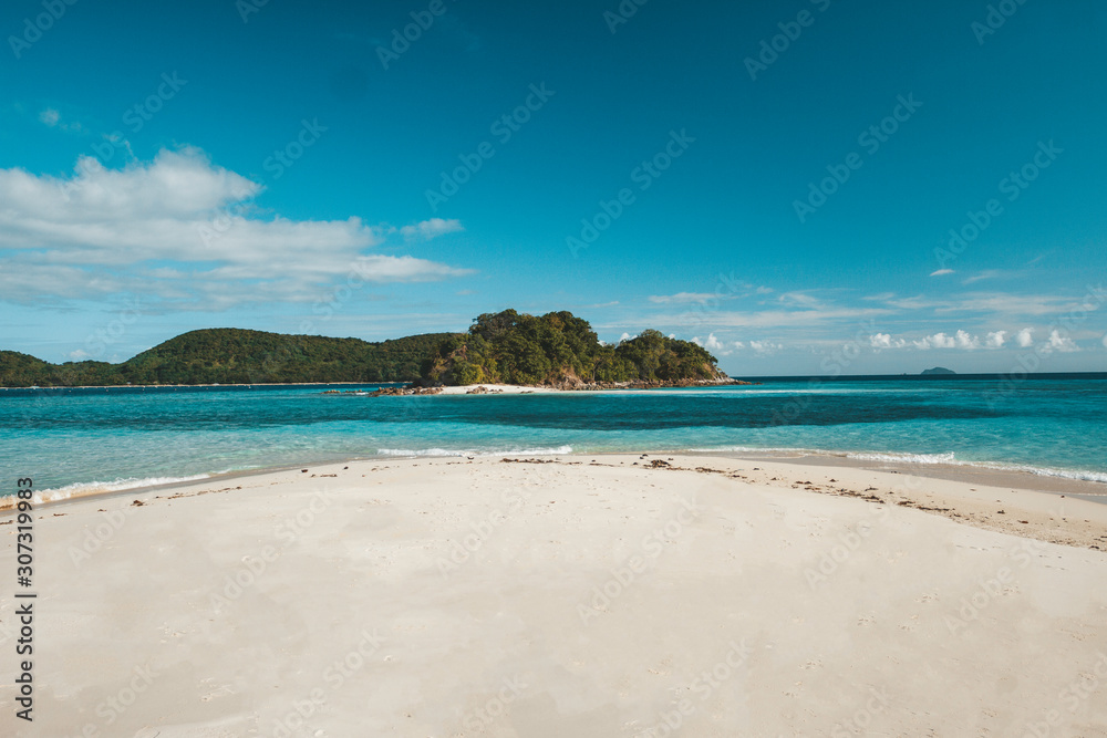 Philippines El nido , Palawan white sand beach without people, blue sky , turquoise water.
