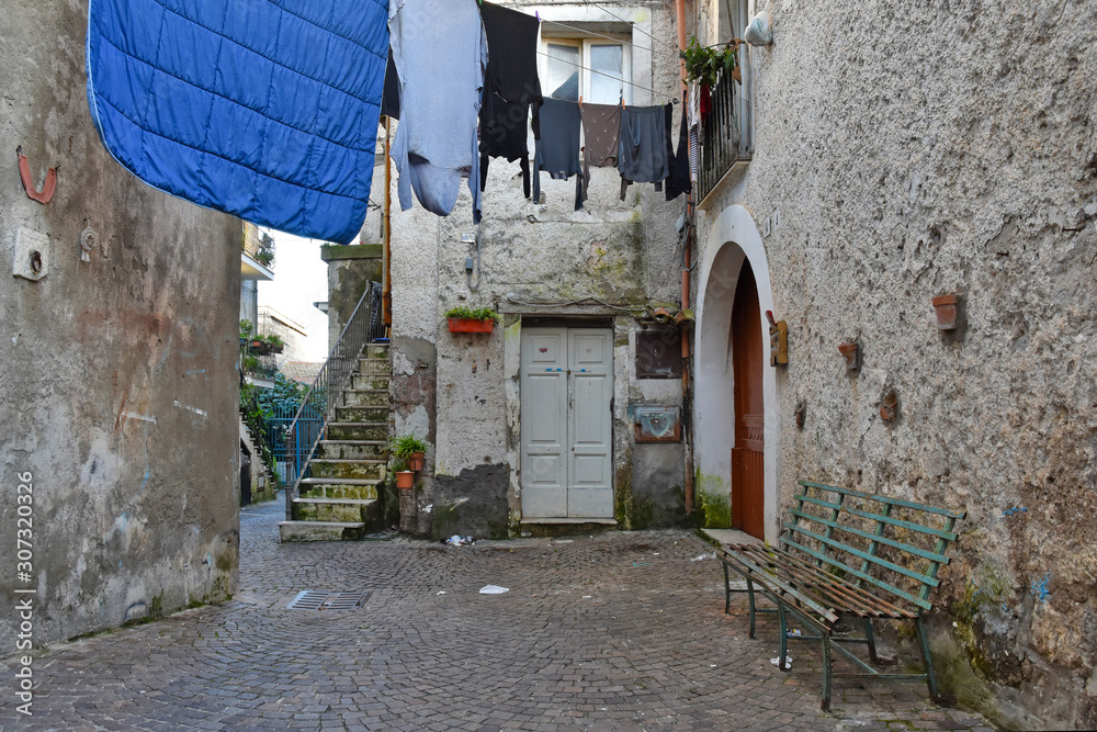Teano, Italy, 11/30/2019. A street among the old houses of a medieval