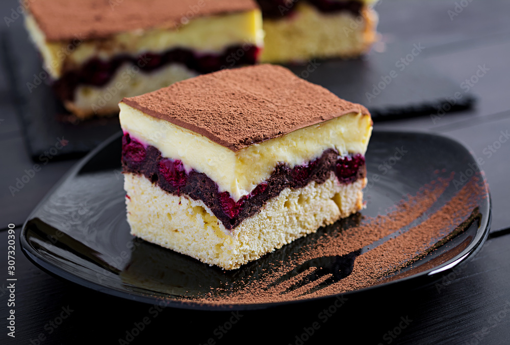 Fotografie Cake cupcake with cherries, cocoa and custard.