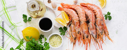 Raw wild Argentinian red shrimps/prawns  and ingredients for cooking. Delicious food. Keto / Paleo Diet. Top view, banner photo