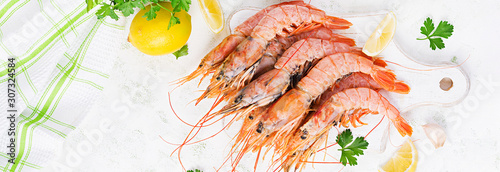 Raw wild Argentinian red shrimps/prawns  and ingredients for cooking. Delicious food. Keto / Paleo Diet. Top view, banner photo