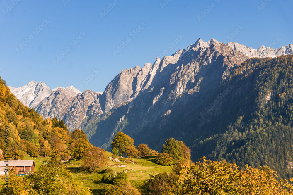 The Swiss Alps at sunset in the Bregaglia valley, near the village of Soglio, Switzerland - October 2019.