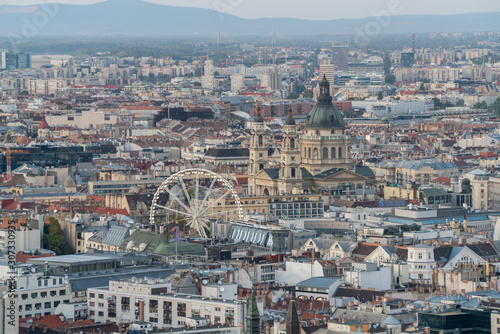 Aerial view of Budapest Cityscape of St. Stephen's Basilica and the ferris wheel in the center of the city © Sen