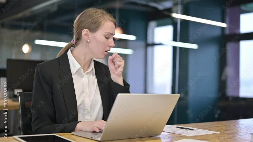 Sick Young White Businesswoman Coughing in Office Sick Young White Businesswoman Coughing in Office