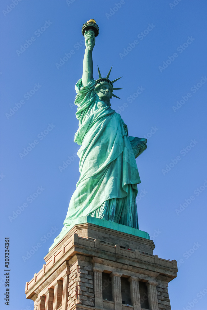 Fototapeta premium Portrait of The Statue of Liberty in New York, USA on a sunny day.