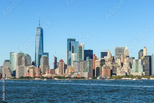 Clean and natural look on the skyline of New York on a clear sky day, low angle horizon, USA