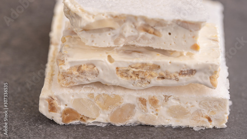 Turron, Spanish hard almond nougat, texture for pattern or background. Close up